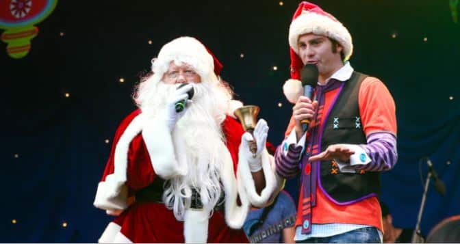 Santa and Jimmy Giggle on stage