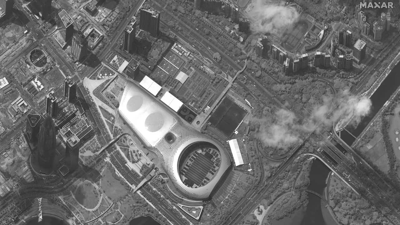 This satellite image captured on Monday, Aug. 12, 2019, appears to show Chinese security force vehicles inside Shenzen, bordering Hong Kong.