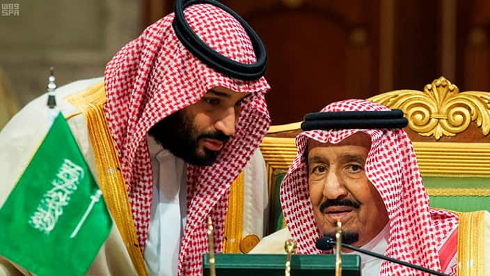 Saudi Crown Prince Mohammed bin Salman, left, speaks to his father, King Salman