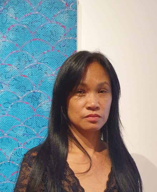 Savanhdary Vongpoothorn posed with her art Steps to Nigatsu-Do (nterlocked wave)