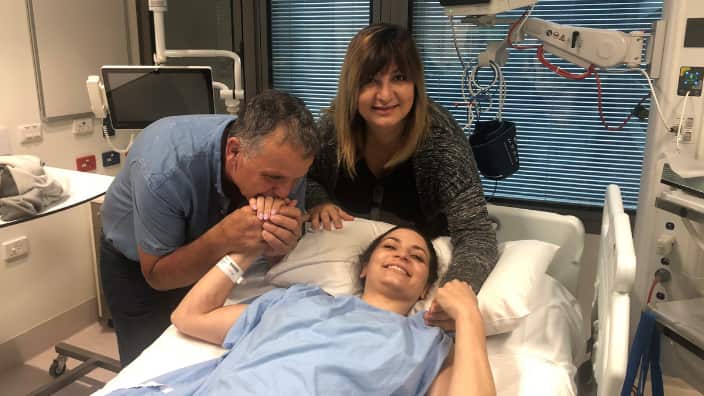 Christina Vithoulkas with her parents
