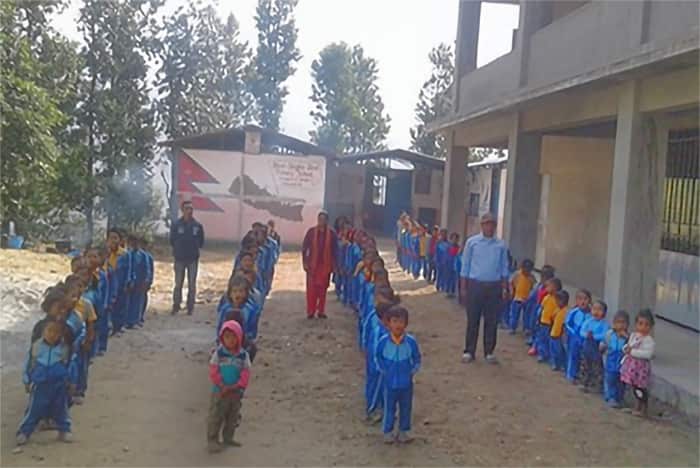 Students line up during a morning assembly at Shree Singha Devi Primary School