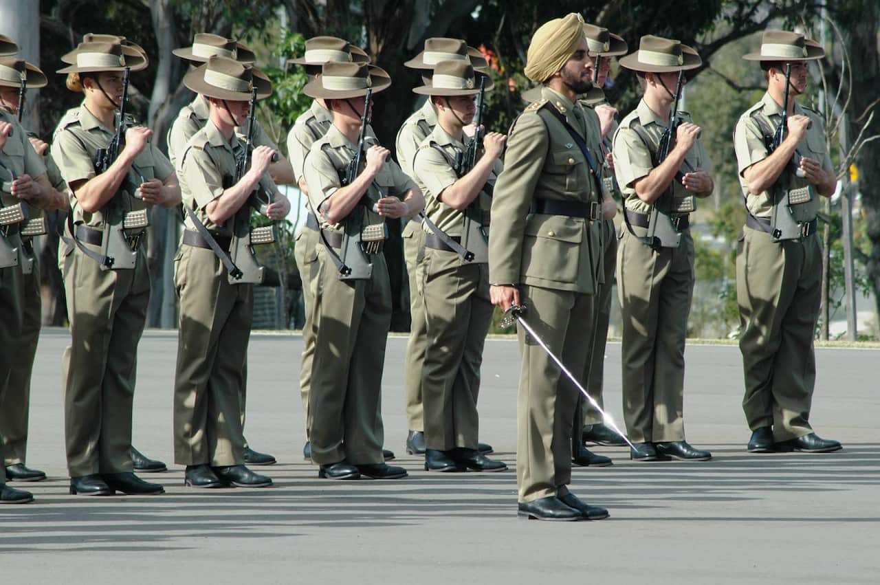 Lieutenant Amrinder Ghuman leads 2 Initial Employment Training Troop in the advance in review order