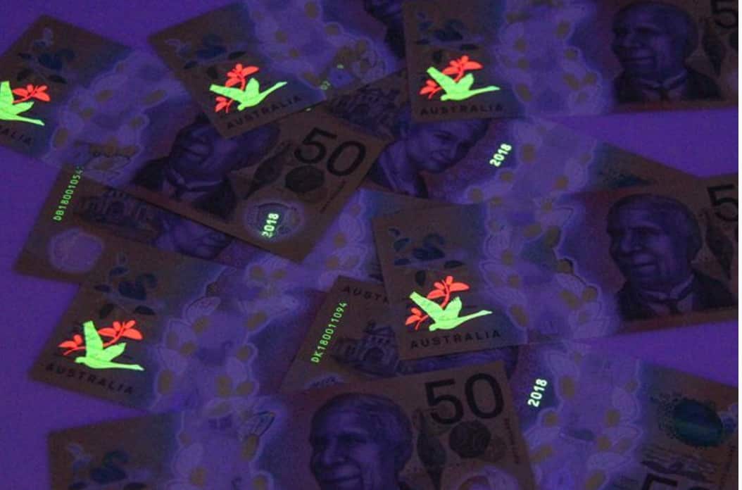50 dollar bill under ultraviolet light