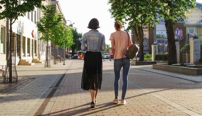 Photo of Women Walking Down the Street
