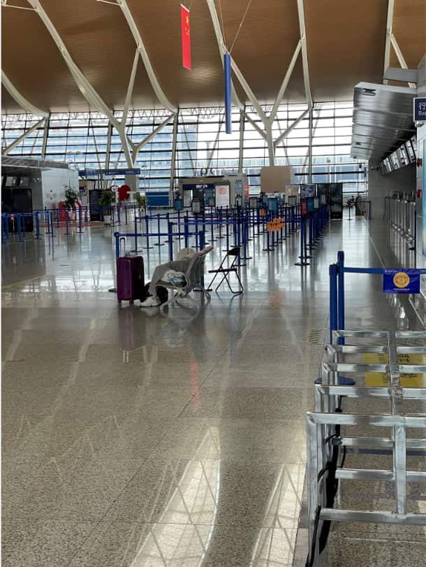 Timothy* walked through an almost empty Shanghai airport on Monday.