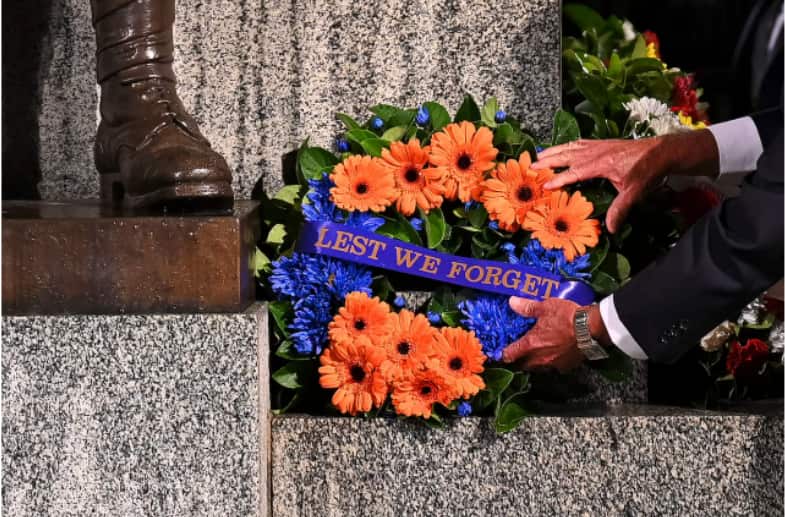 A tribute left by a member of the public rests against the Cenotaph during the annual Anzac Day Dawn Service at Martin Place in Sydney. 