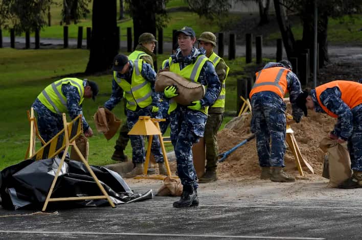 Members of the Australian Defence Force (ADF) prepare sandbags for residents in Windsor, northwest of Sydney.