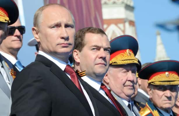 Russia's President Vladimir Putin (left) and Prime Minister Dmitry Medvedev (centre).