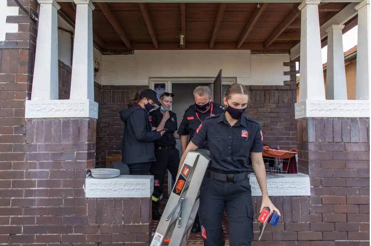 Firefighters from Lakemba fire station after conducting a home inspection.