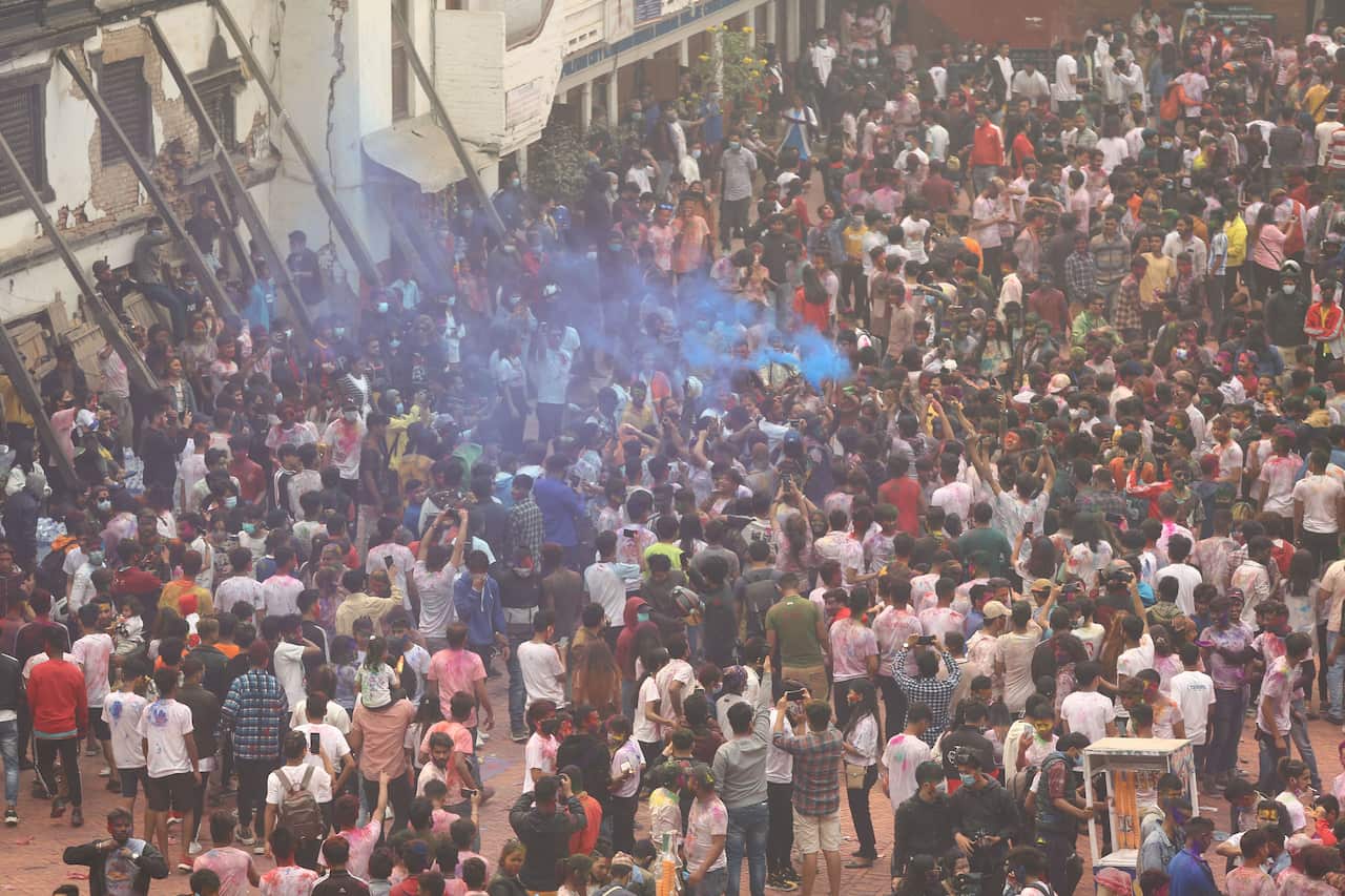 People gather to celebrate holi festival in nepal.