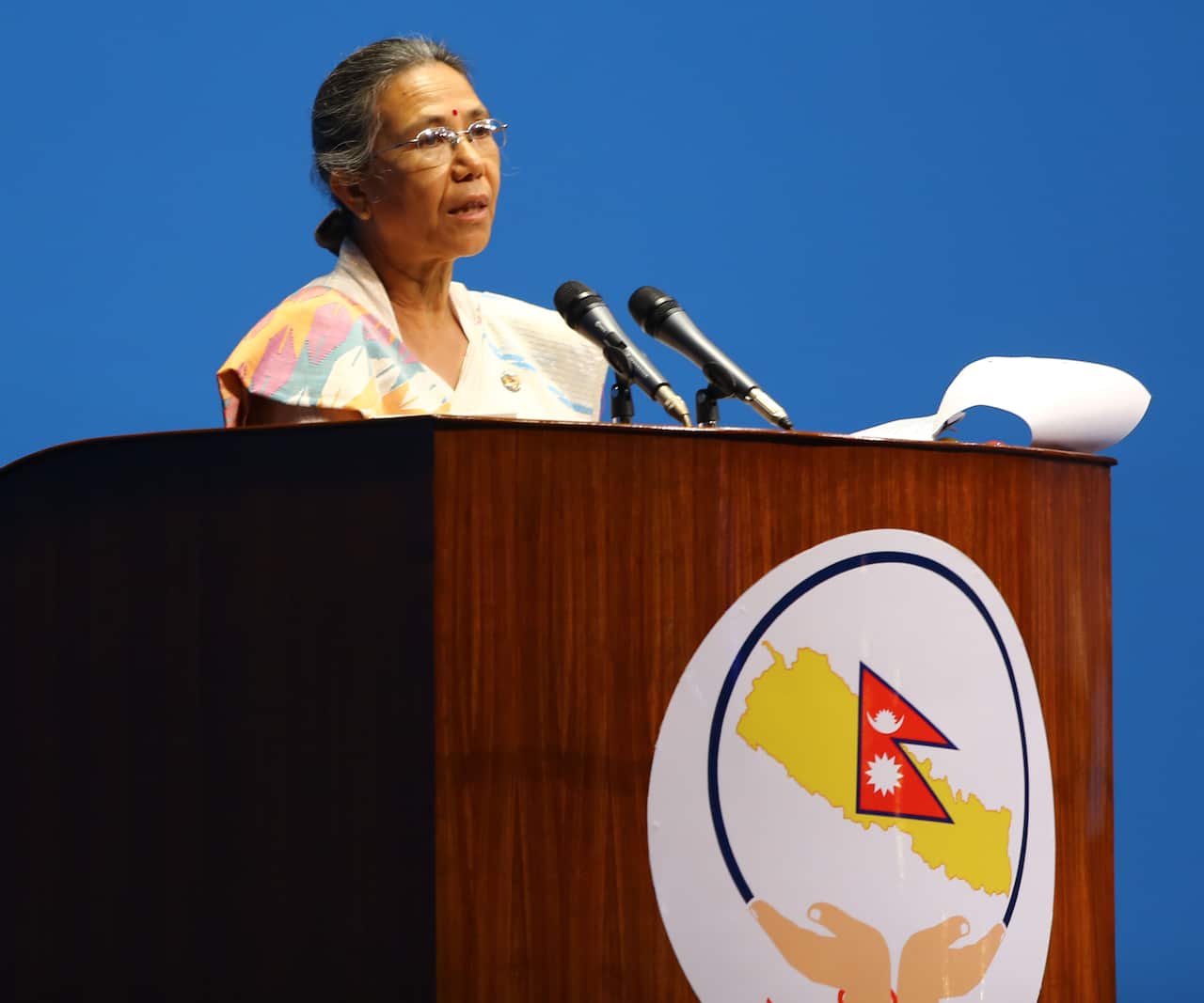 Shashi Shrestha, head of parliamentary committee on State Affairs, presents the citizenship bill in the parliament