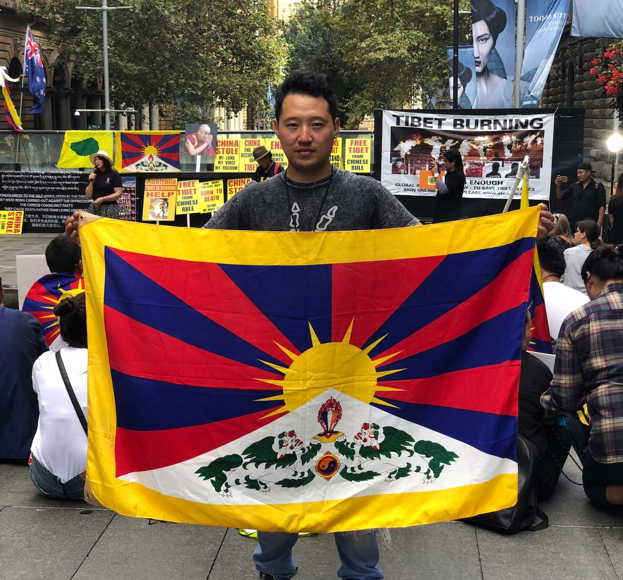 Sherge holding the Tibetan National flag 