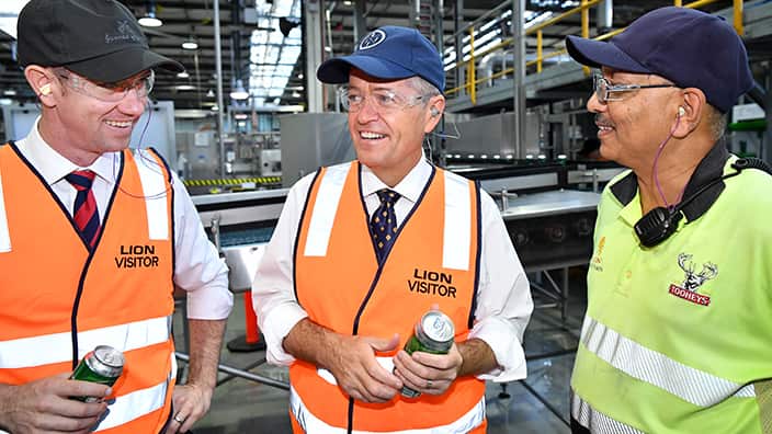 ederal Opposition Leader Bill Shorten (centre) and Labor Candidate for Reid Sam Crosby (left) inspect fresh cans of beer