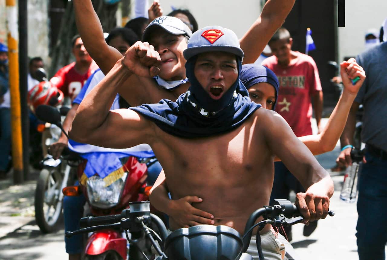 Anti-government protesters arrive by caravan from the capital to show solidarity with the town of Masaya, Nicaragua, Sunday, May 13, 2018.