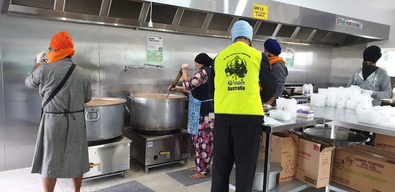 A team of Sikh volunteers preparing meals at a community kitchen in Melbourne's south-east. 