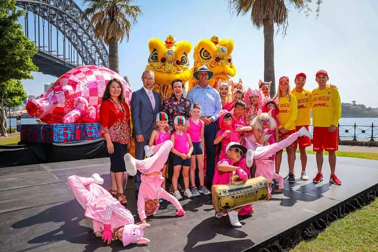 Group photograph with Lord Mayor Clover Moore,  Councillor Robert Kok, Surf Life Saving NSW CEO Steven Pearce, Sydney Lunar Festival Curator Valerie Khoo and Dancekool roving pigs dancers.