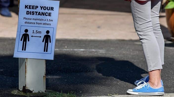 Social distancing signage is seen at the entrance of the Sydney Fish Market in Sydney, 10 April 10 2020.