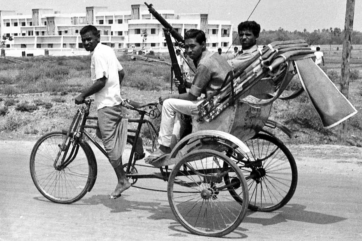 armed East Pakistan fighters head for the battle front by pedicab, in Jessore, East Pakistan.
