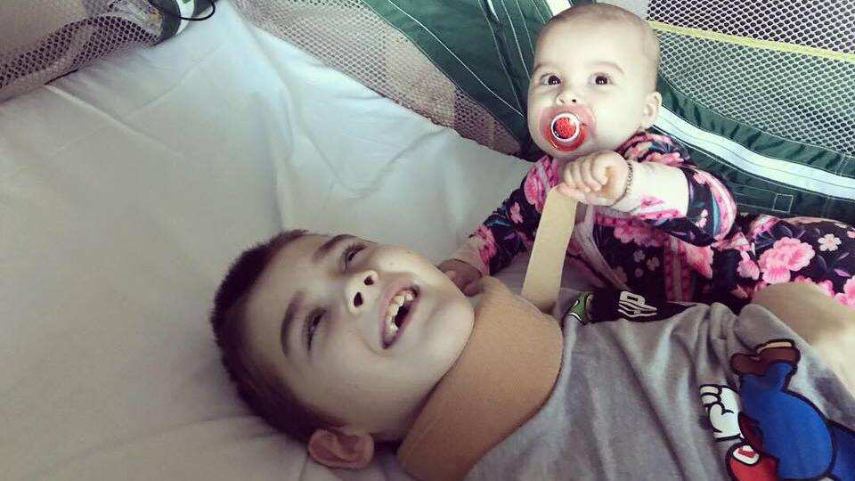 Miller and his baby sister six-month-old Maison