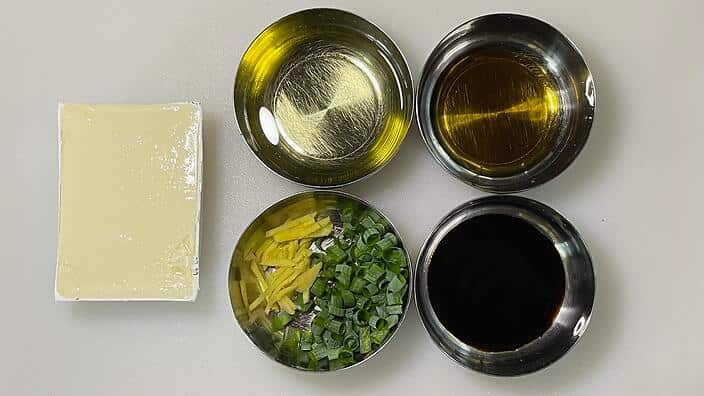 Drain your silken tofu pack and pat the block dry with a paper towel.