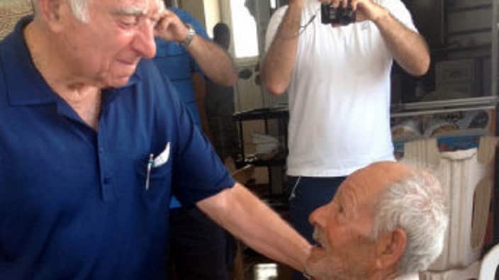 Ms Jacobs grandfather Costas reuniting with his best friend Mehmet Emin, in Agia Irini, in 2013.