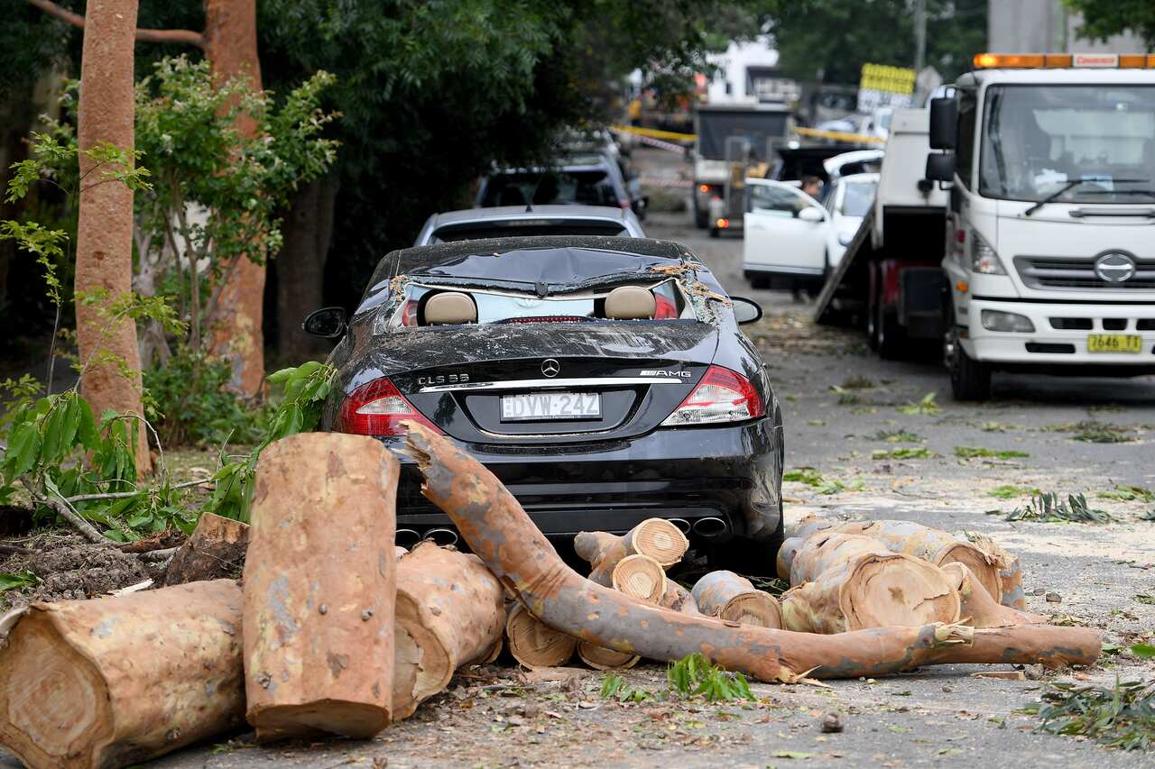 Storm damage is seen in Gordon, north of Sydney, Tuesday, November 26, 2019. A severe fast moving thunderstorm has passed over Sydney resulting in fallen trees and downed power lines in several Sydney suburbs. (AAP Image/Dan Himbrechts) NO ARCHIVING