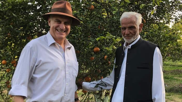 ACIAR CEO, Professor Andrew Campbell, meeting with Mr Ilyas, a citrus farmer in Pakistan.
