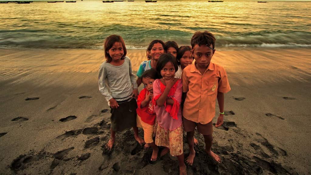 Happy children in NTB playing on the beach