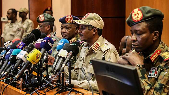 Gen. Mohamed Hamdan Dagalo, the deputy head of the military council, second right, speaks at a press conference in Khartoum, Sudan