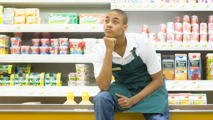 Teenage supermarket employee