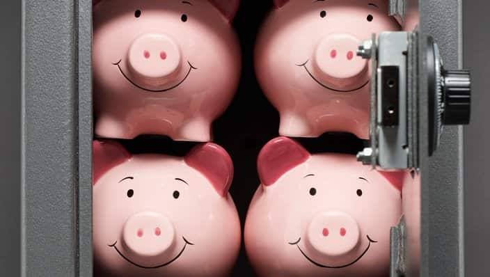 Four piggy banks in safe