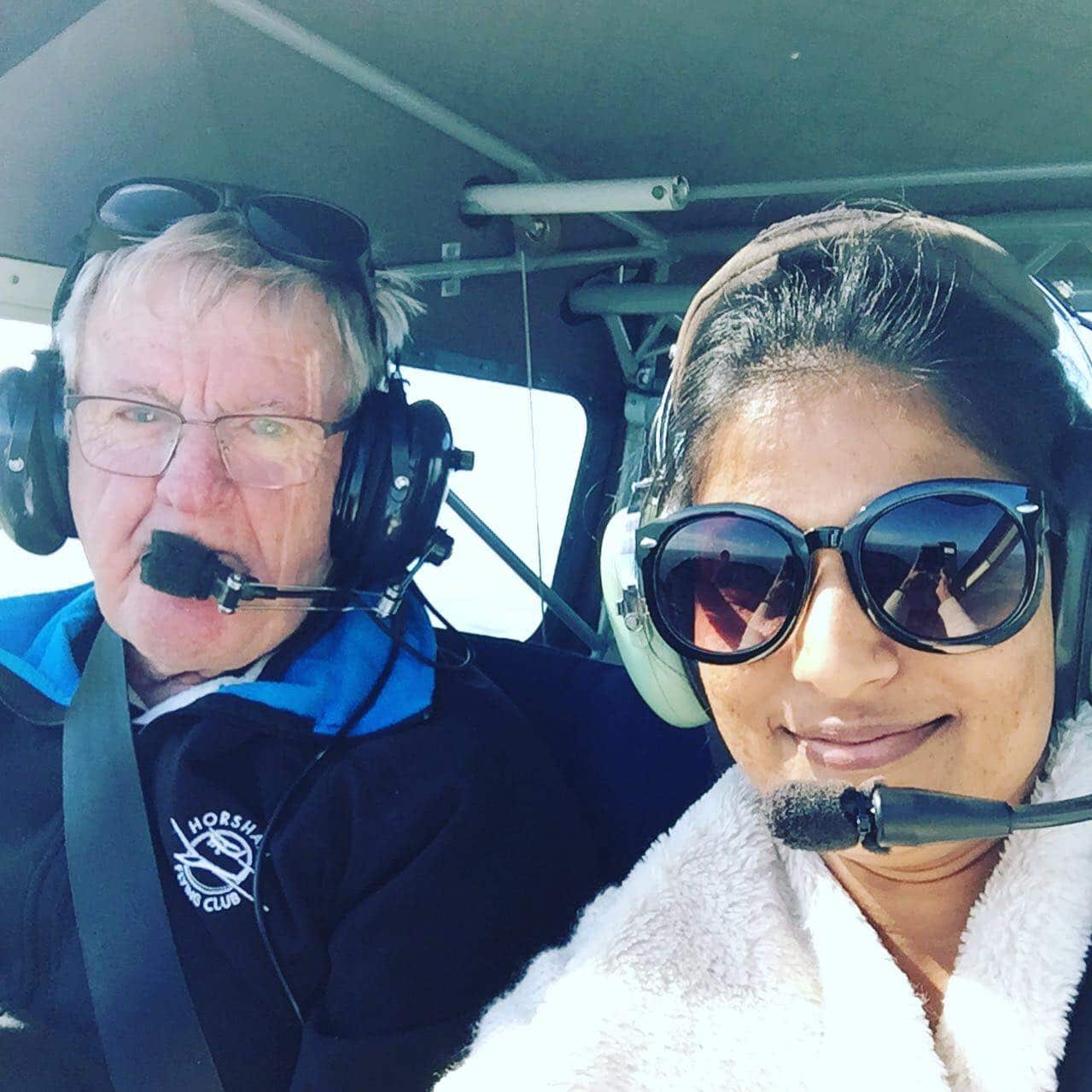 Sweta with instructor in the aircraft.