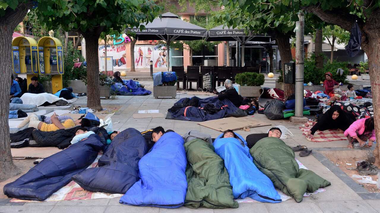 refugees, migrants sleeping rough in an Athens square Greece