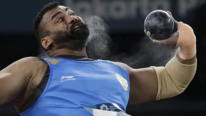 India's Tajinderpal Singh Toor throw's in the men's shot put final during the athletics competition at the 18th Asian Games in Jakarta, Indonesia, Saturday, Aug. 25, 2018. (AP Photo/Lee Jin-man)
