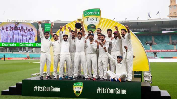 Indian players hold up the Border/Gavaskar trophy on day five of the Fourth Test match between Australia and India at the SCG in Sydney.