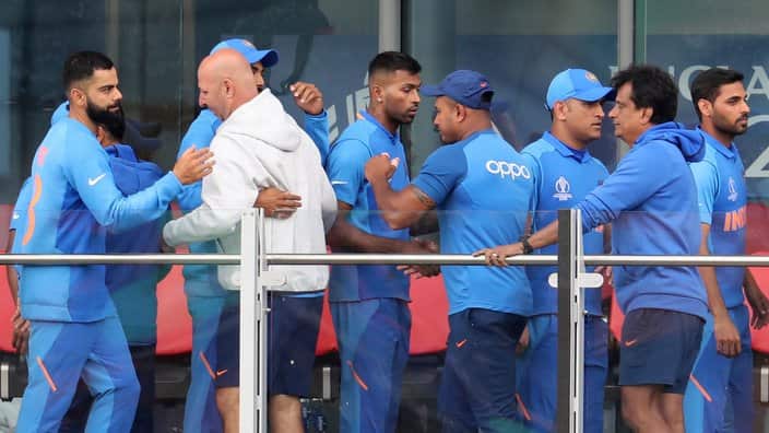 Indian cricketers greet each other after losing the 2019 World Cup semifinal to New Zealand at Old Trafford in Manchester.