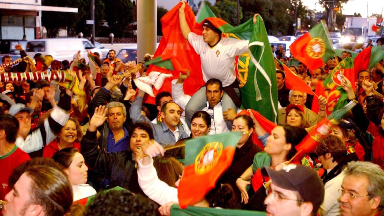 July 1, 2004. Supporters from Sydney's Portugese community celebrating outside Canterbury-Hurlstone Park RSL after Portugal defeated Holland 2-1 at Euro 2004
