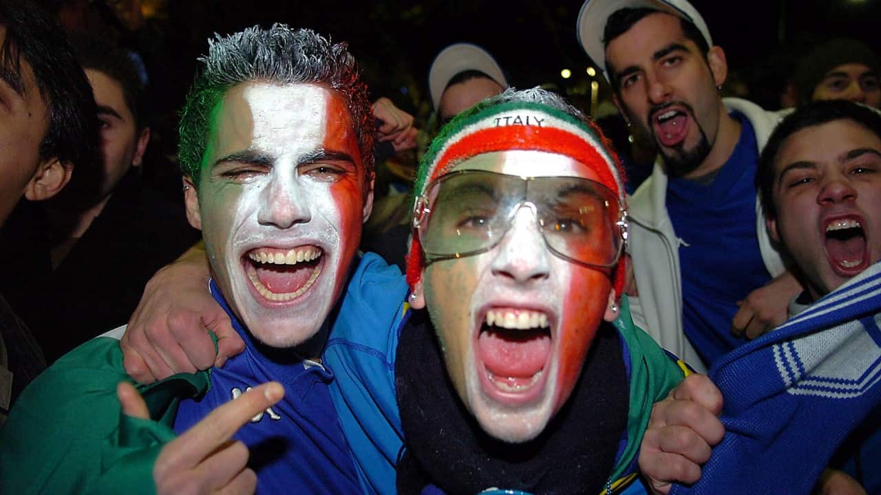 Italian soccer fans celebrate on Lygon Street in Melbourne after Italy beat Australia 1-0 in their 2006 World Cup match, after watching the game on a big screen