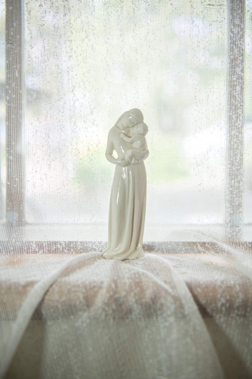 A figurine of Lady with a baby