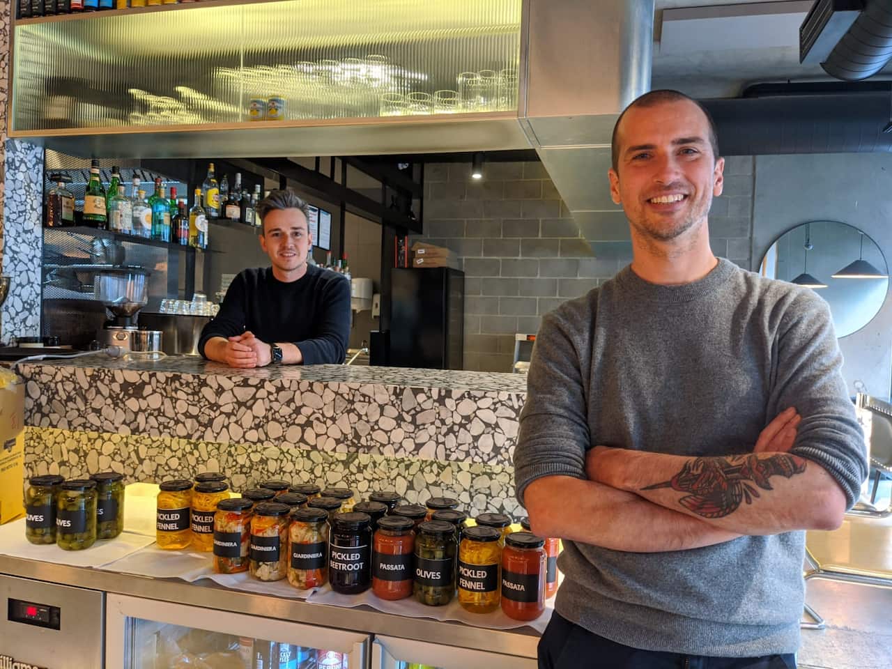 Marco Scalisi (a destra), col suo socio, Andrea Da Como, all'interno del loro ristorante di Windsor, Tipico