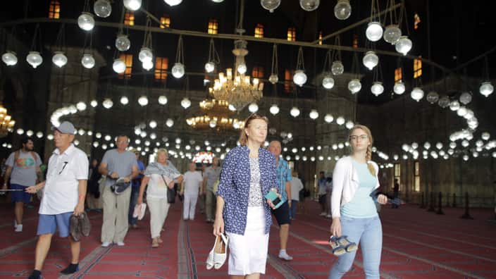 Tourists visit the Mosque of Muhammad Ali inside Saladin Citadel in Cairo, Egypt, 15 October 2018