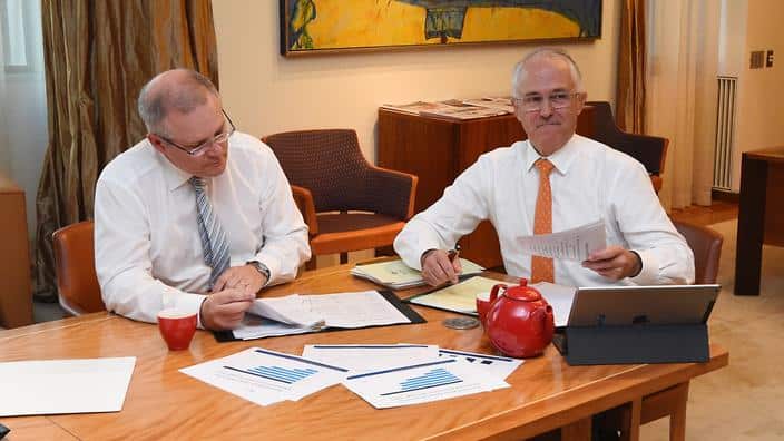 Treasurer Scott Morrison and PM Malcolm Turnbull looking at the Budget Paper