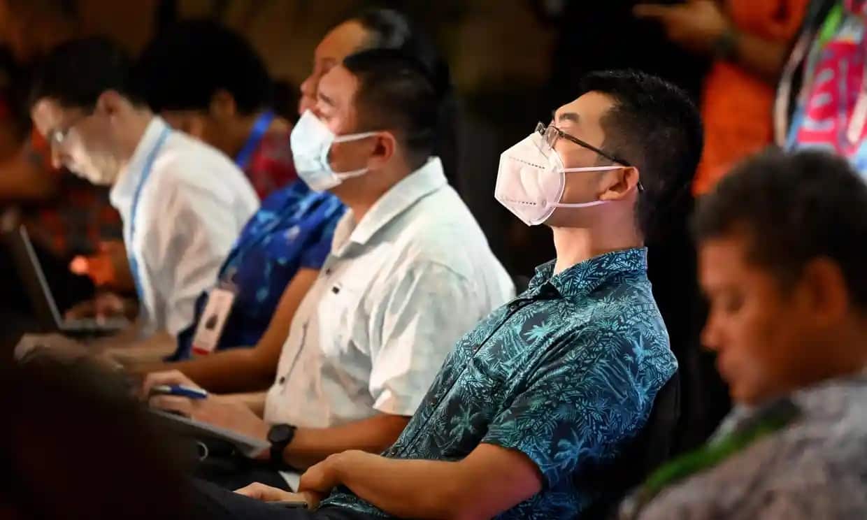 Two Chinese officials listen to US vice-president Kamala Harris’s virtual address at the Pacific Islands Forum in Fiji before being asked to leave the meeting.
