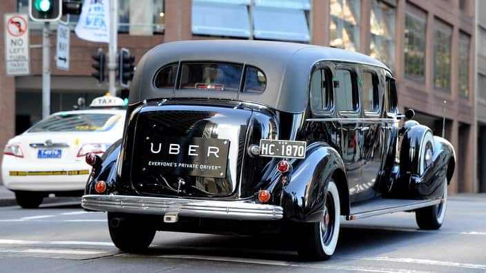 Uber signage seen on a vintage car in Sydney, Friday, July 3, 2015. The NSW government has launched a task force to look at regulating the ride-sharing company. (AAP Image/Joel Carrett) NO ARCHIVING