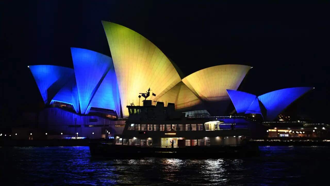 The Opera House sails are lit with the colours of the Ukranian national flag on 28 February, 2022 in Sydney, Australia