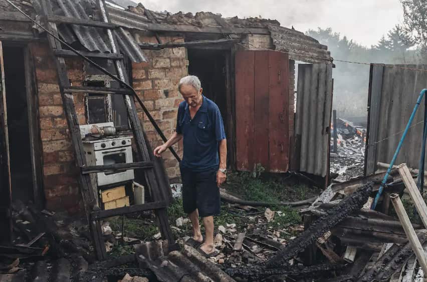 A Ukrainian man is seen examining his destroyed house, which was burned to ashes in the fire caused by the shelling, as the Russia-Ukraine war continues in Opytne, Donetsk Oblast, Ukraine on 1 August, 2022