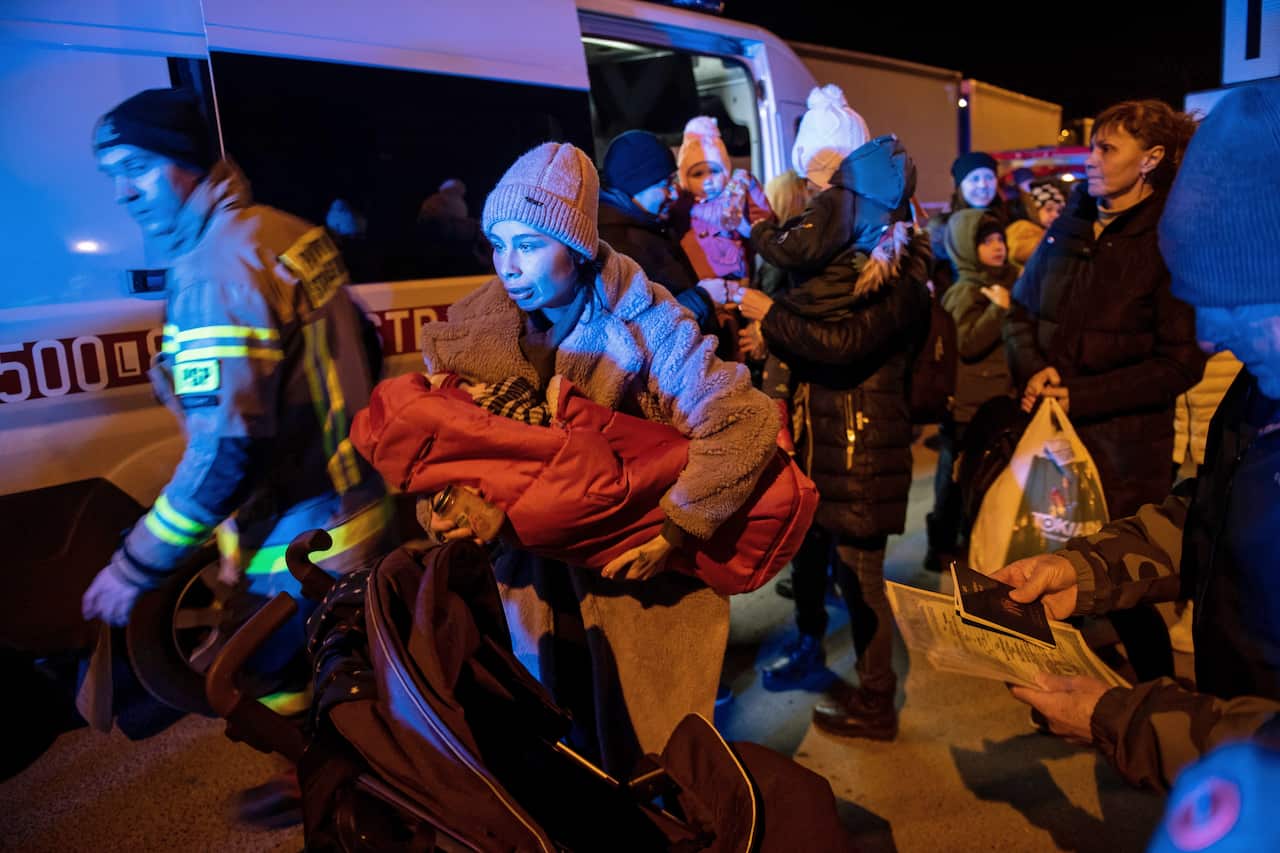Refugees from Ukraine gather near the Polish-Ukrainian border in Hrebenne, southeastern Poland.