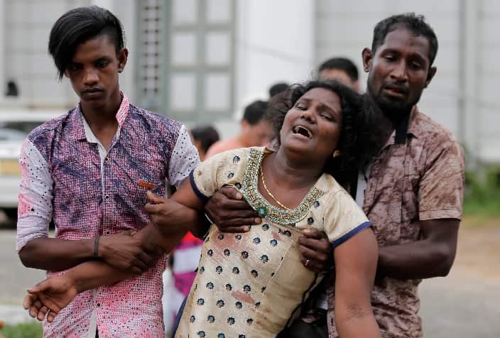 Relatives of a blast victim grieve outside a morgue in Colombo, Sri Lanka, Sunday, April 21, 2019.