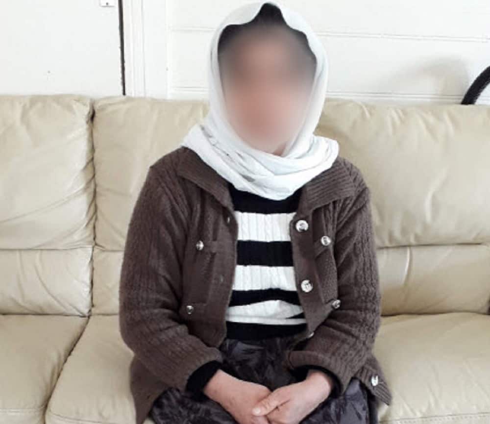 Yazidi mother waits to be reunited with son.